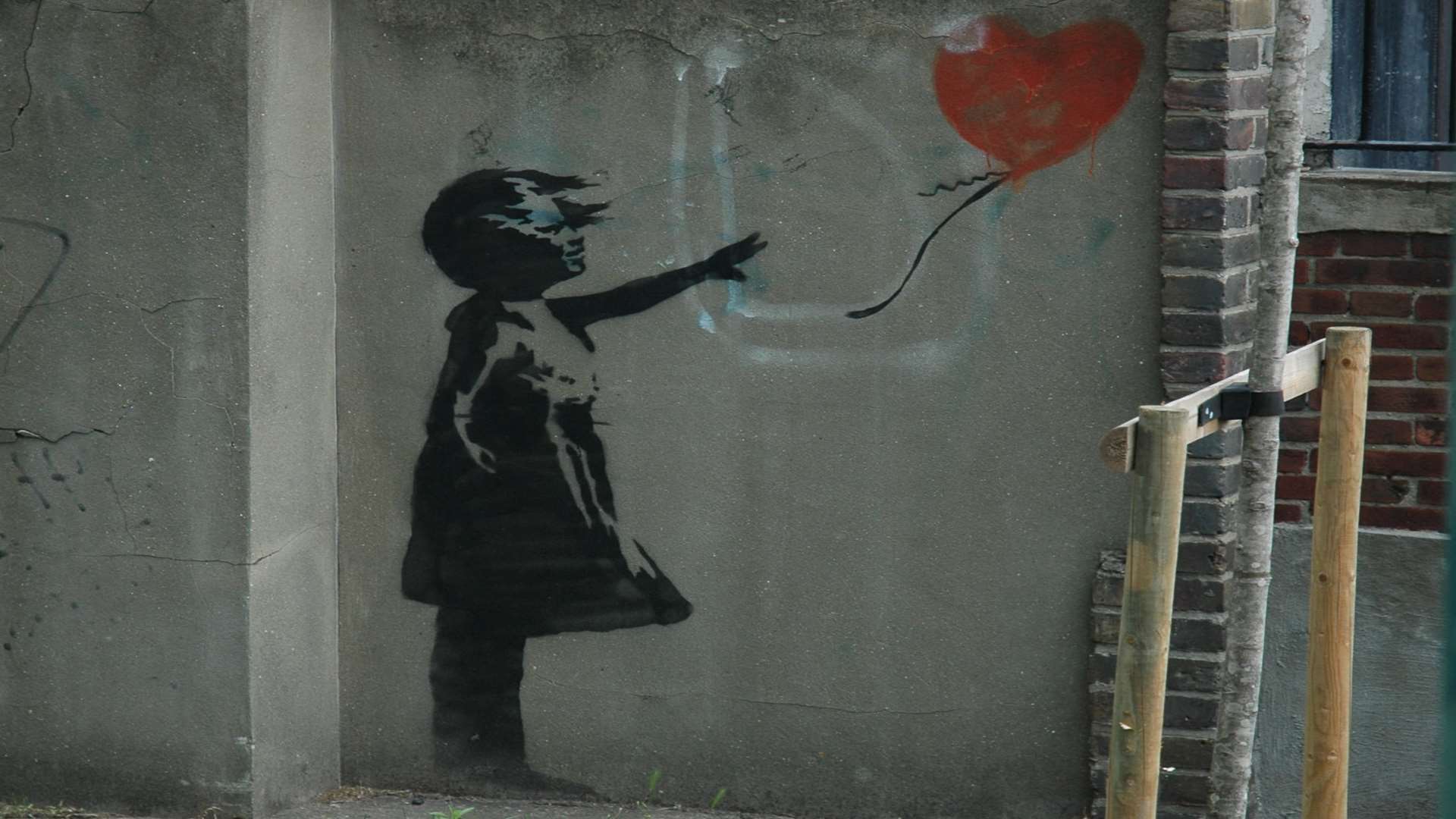 A similar work, thought to be by Banksy, on a wall in London