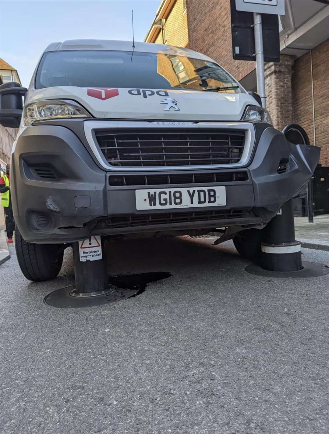 The van wedged onto the anti-terror bollards. Picture: Graham Thurlow