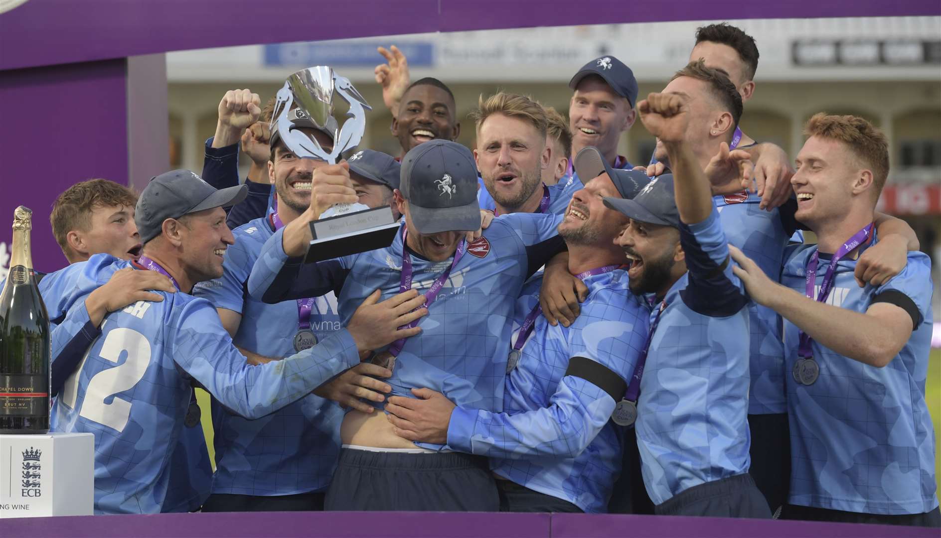 Captain Joe Denly feels the love of his team-mates after lifting The Royal London One-Day Cup. Picture: Barry Goodwin