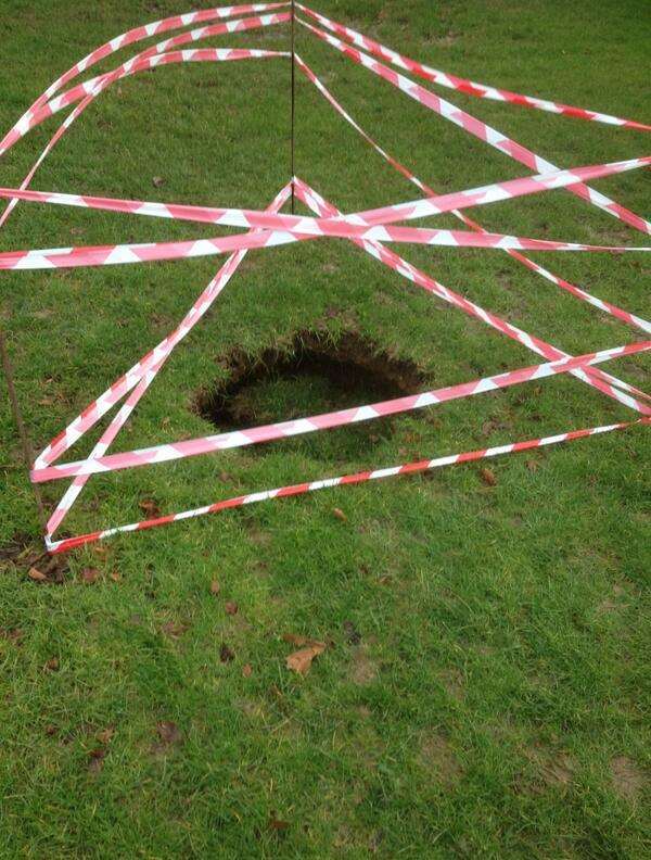 This sink hole has appeared at Tenterden recreation ground . Photo: Jonathan Medes