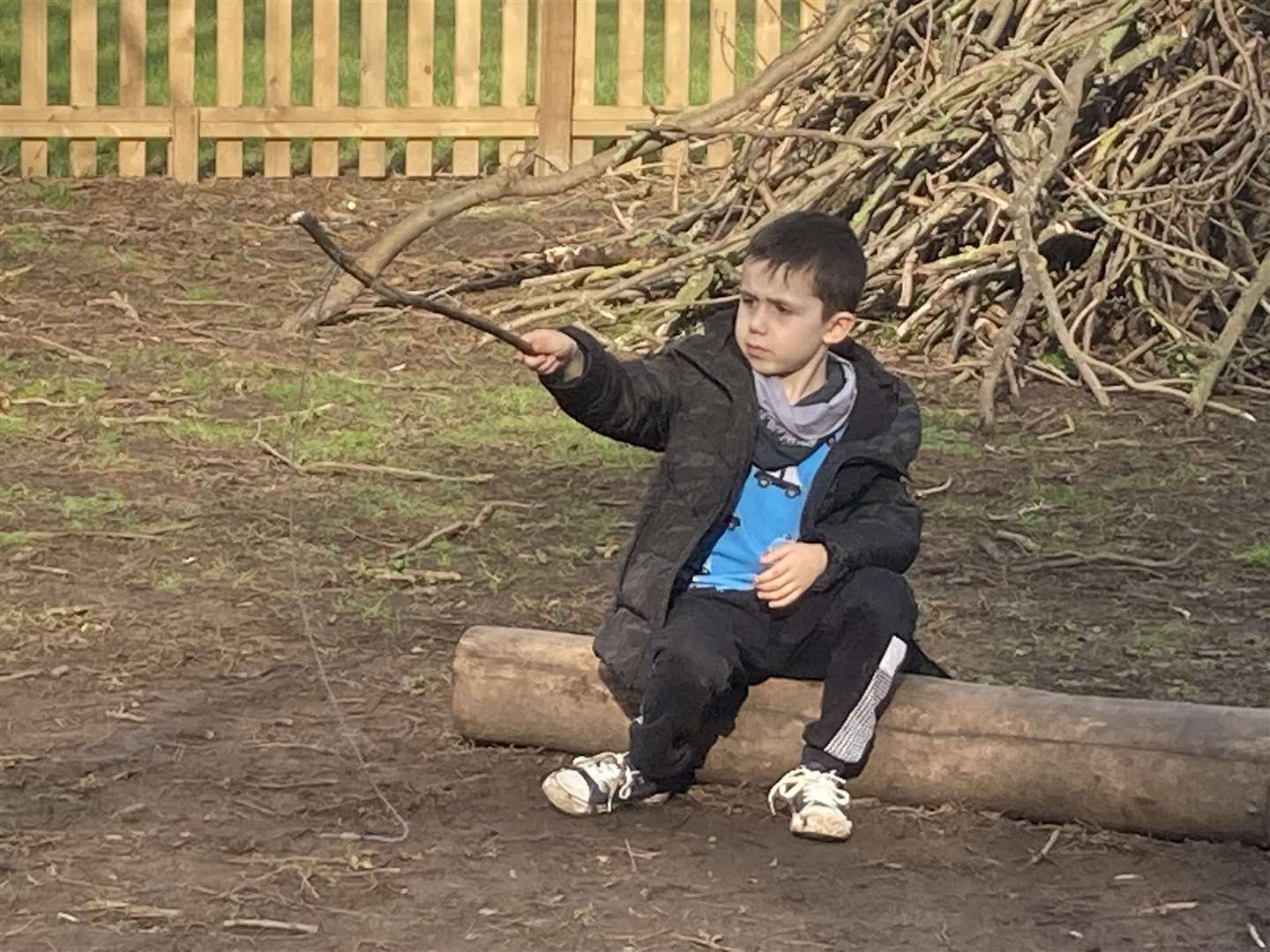 Luis, 6, and his stick during forest school at Sunny Bank Primary School