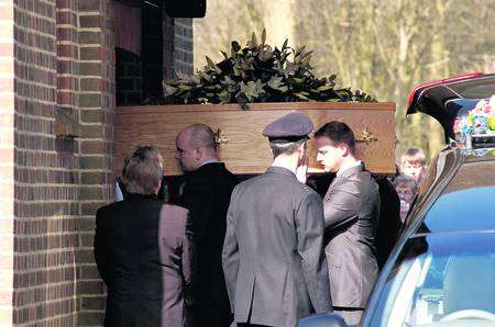 Chris Peacock's coffin is carried into the chapel