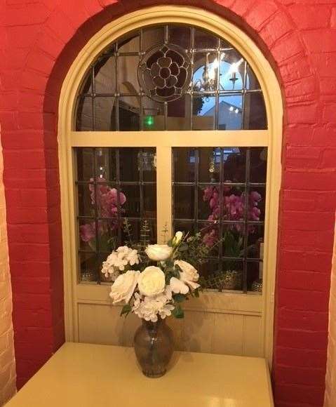 This particular window, with flowers in front, felt a little like the entrance to a shrine to me