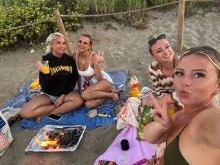 They had a BBQ on the beach following the cancellation as they needed to save money. Picture: Maisie Stanhope