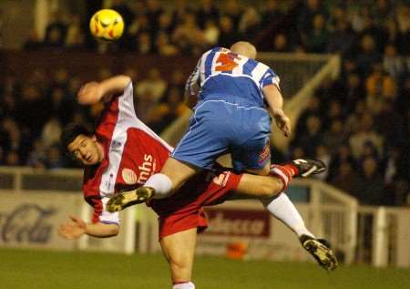Gillingham's Matt Jarvis is strongly tackled by Michael Nelson. Picture: BARRY GOODWIN