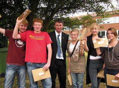 Students from Westlands School celebrate their GCSE results with head teacher Jon Whitcombe