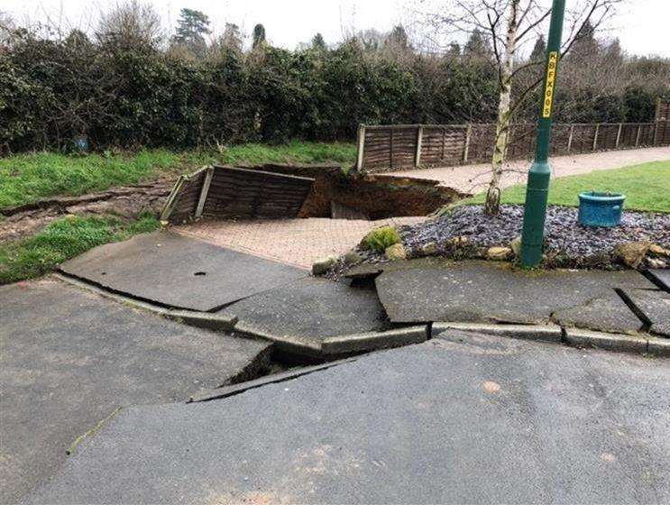 The sinkhole left dramatic cracks in the road and pavement. Picture: Sarah Nickels (1366591)