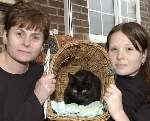 RELIEVED: Mandy Simpson and daughter Gemma with Belle, one of their other cats. Picture: DAVE DOWNEY