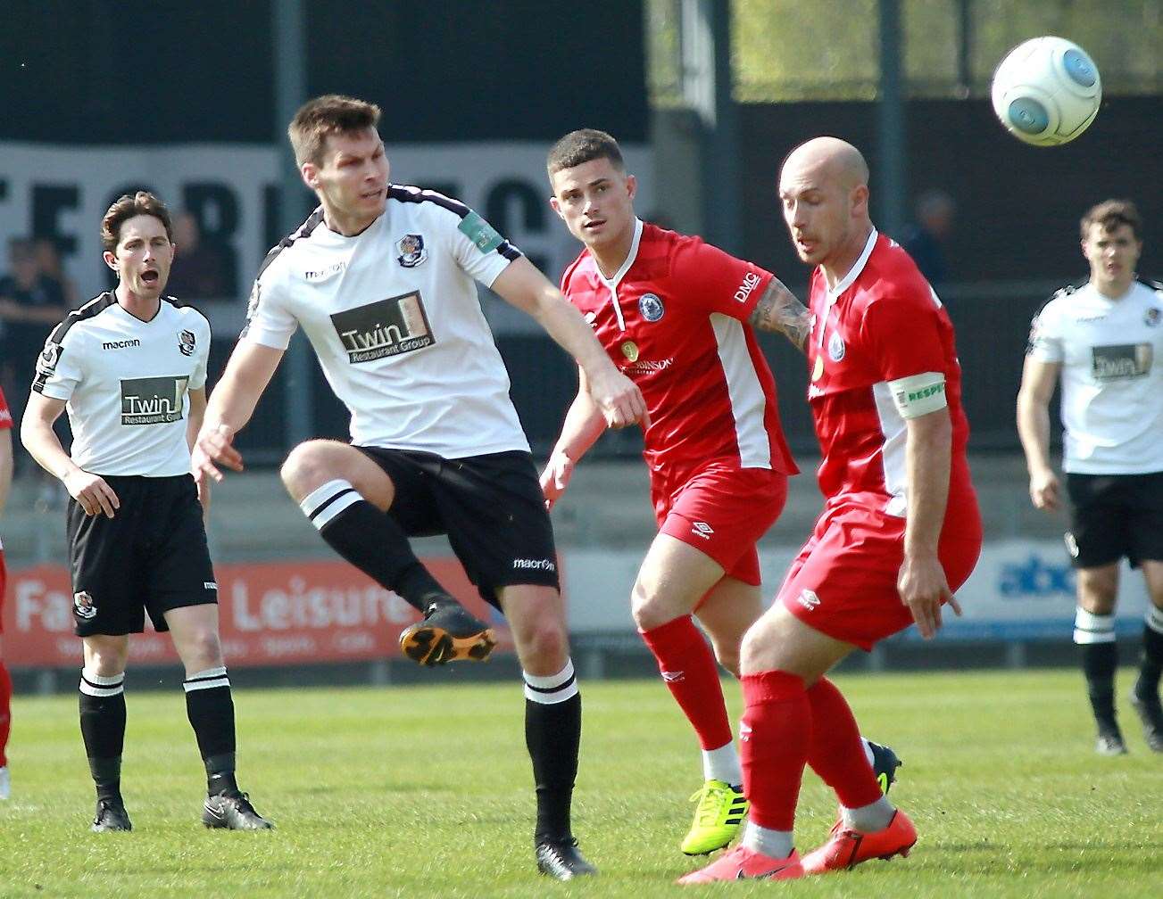 Charlie Sheringham plays the ball forward for Dartford against Billericay. Picture: Phil Lee
