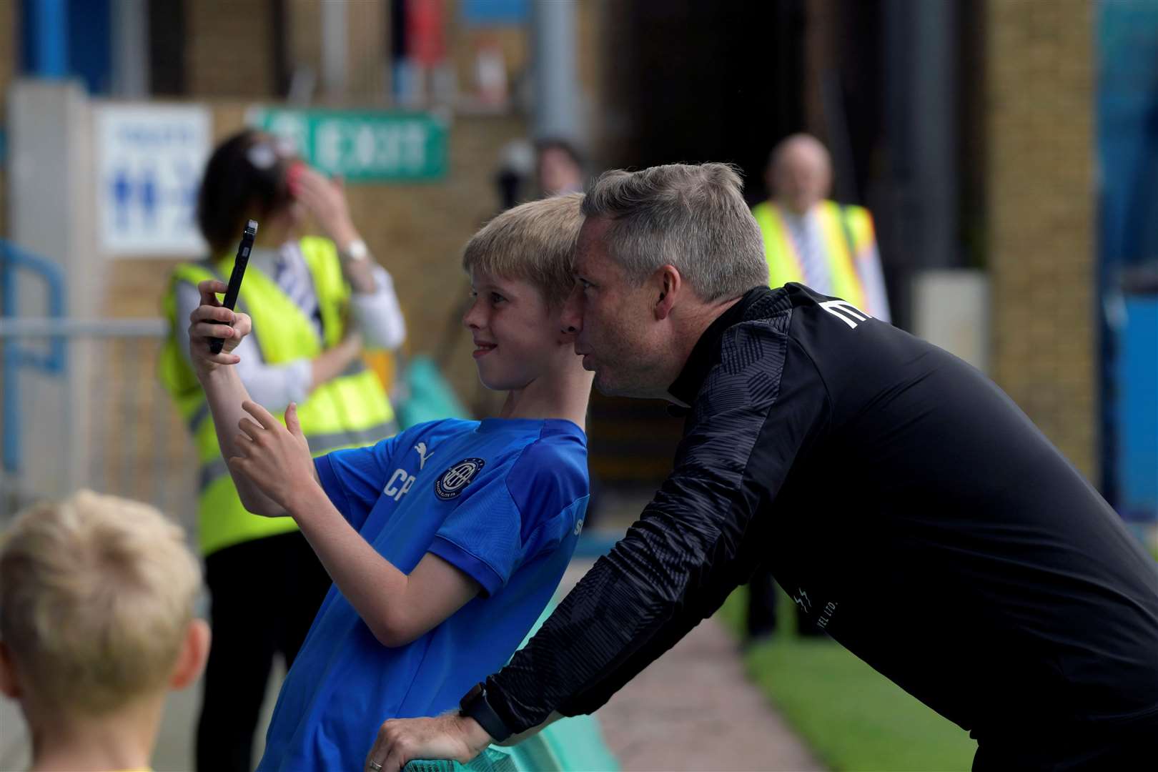 Manager Neil Harris poses with a young fan at Priestfield Picture: Barry Goodwin