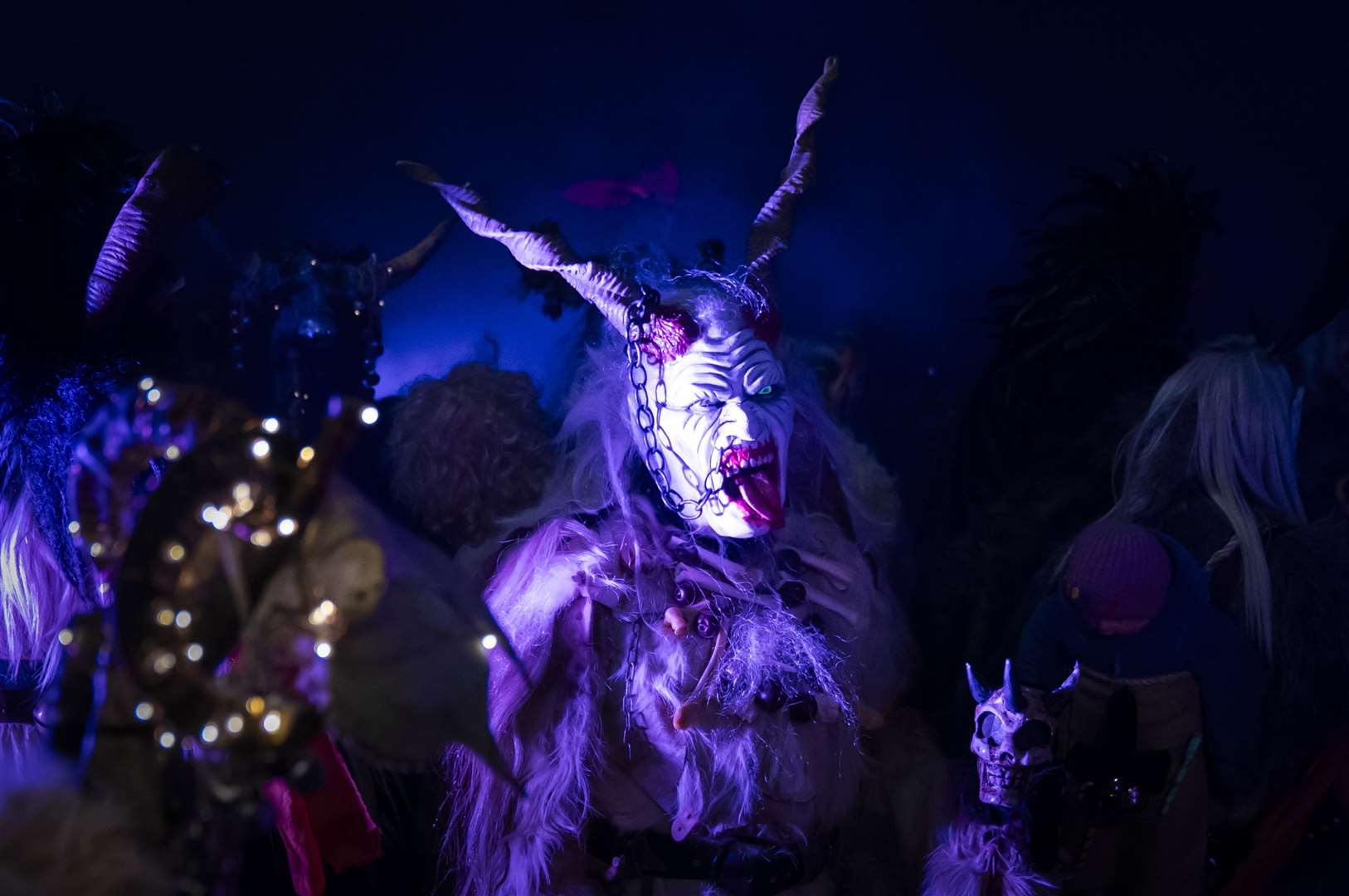 A creepy costumed figure during the Whitby Krampus Run in Whitby, Yorkshire, which celebrates the Krampus, a horned creature which accompanies Saint Nicholas on his rounds in December (PA)