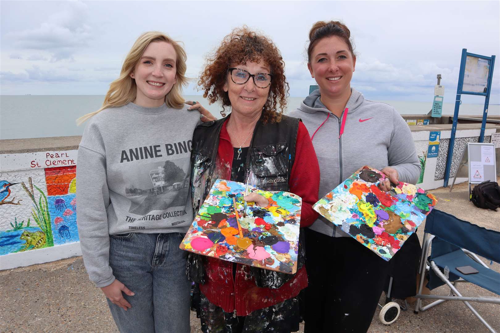 Emma Dunnicliffe, left, from Big Local Eastern Sheppey with mother and daughter artists Julie Bradshaw-Drury and Anna Piles on Leysdown Promenade