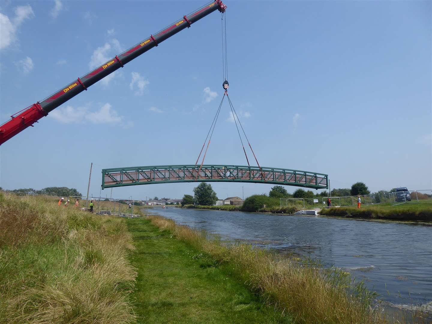 The new £105,000 metal footbridge is gently lowered into position at Barton's Point Coastal Park, Sheerness, Sheppey. Picture: Chris Reed