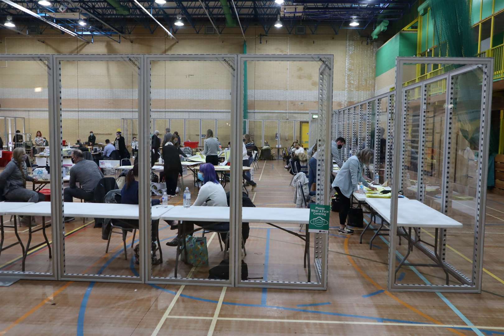 Inside the KCC election count at Swallows Leisure Centre, Sittingbourne, with giant Perspex screens protecting the counters to comply with Covid regulations