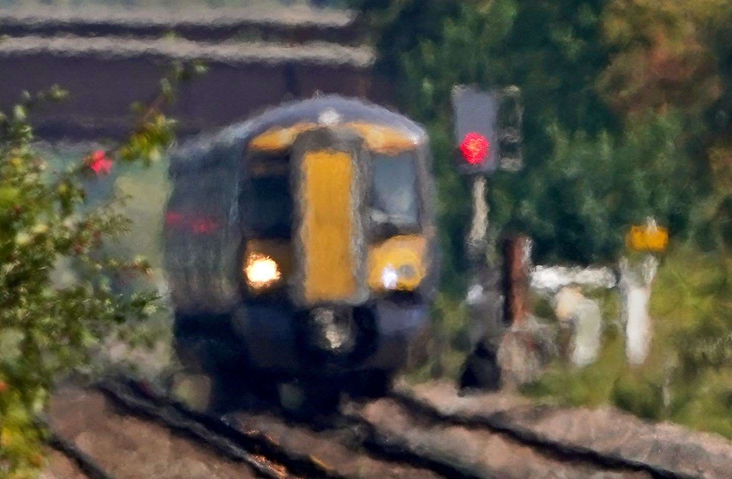 A train passes through heat haze on a railway line in Ashford, Kent (Gareth Fuller/PA)