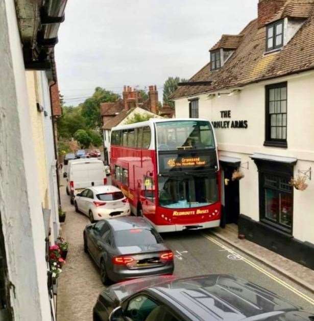A picture taken last year before the introduction of the bollards shows a bus struggling to get past outside the Darnley Arms. Photo: @CobhamTrafficDiary