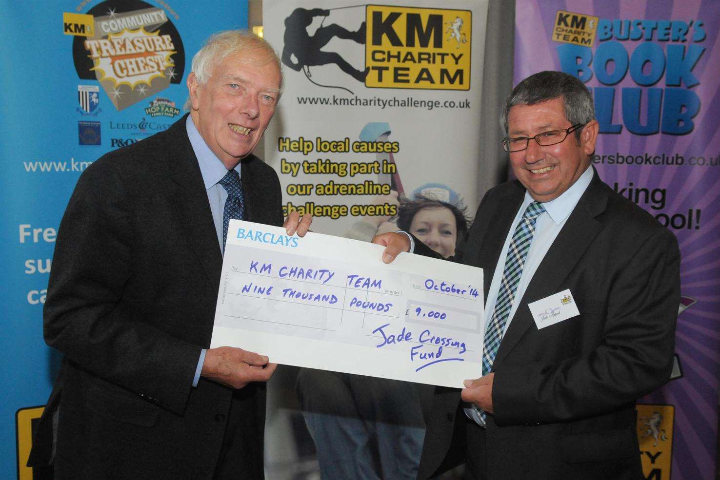 Tim Fleck of the Jade Crossing Fund (right) presents Martin Vye of the KM Charity Team with a £9,000 cheque for the KM Walk to School campaign at the KM Charity Team Forum 2014