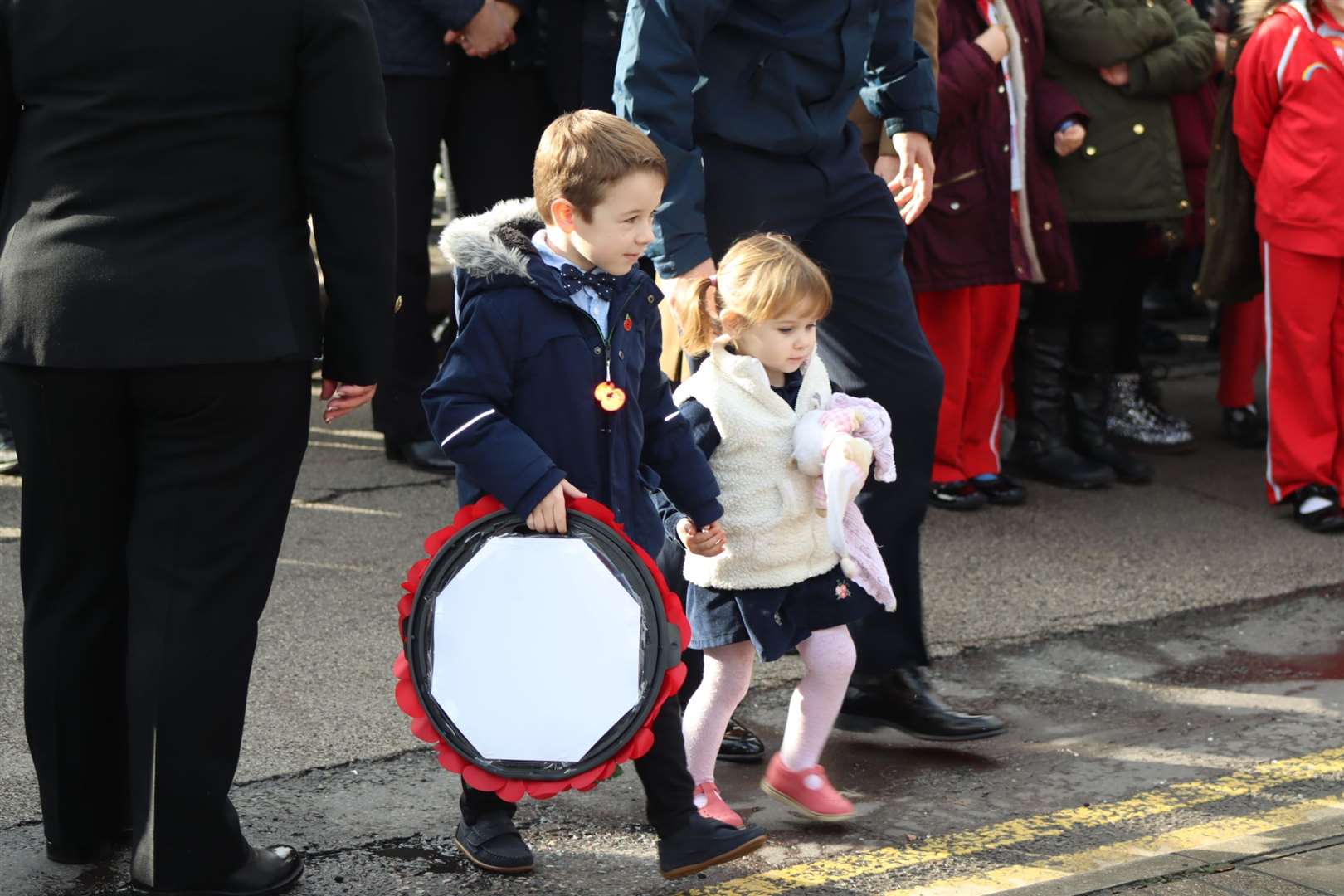 Two of the youngest wreath-layers at Sheerness war memorial on Sunday, James Locker, five, and his sister Belle, two, helped their uncle Luke Allum lay a wreath on behalf of his funeral firm. It was James' third time and Belle's first. (21306273)