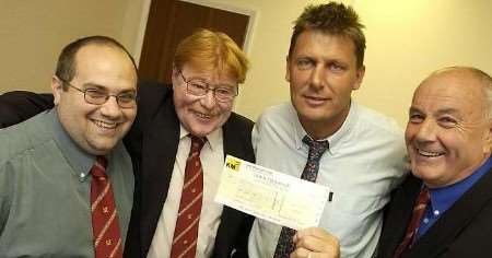 The cheque is officially handed over. Picture: GRANT FALVEY