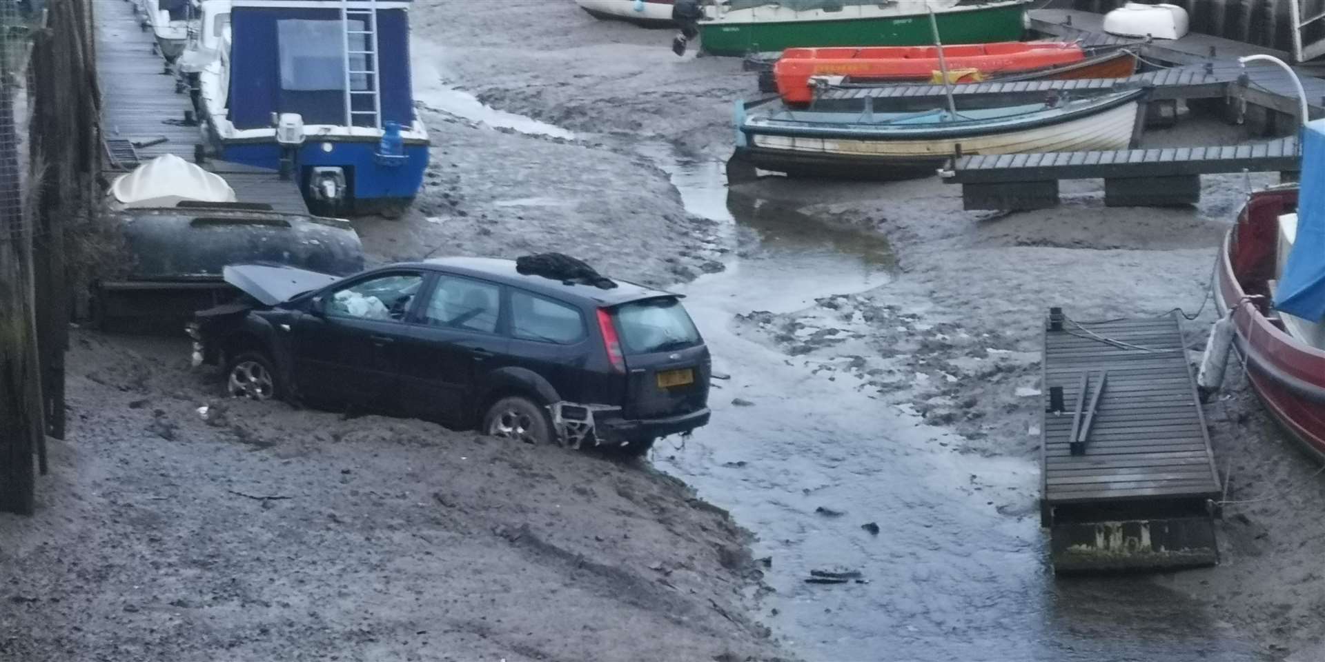 Car crashes into Oare creek by Youngs Boat Yard off The Street Oare (7057587)