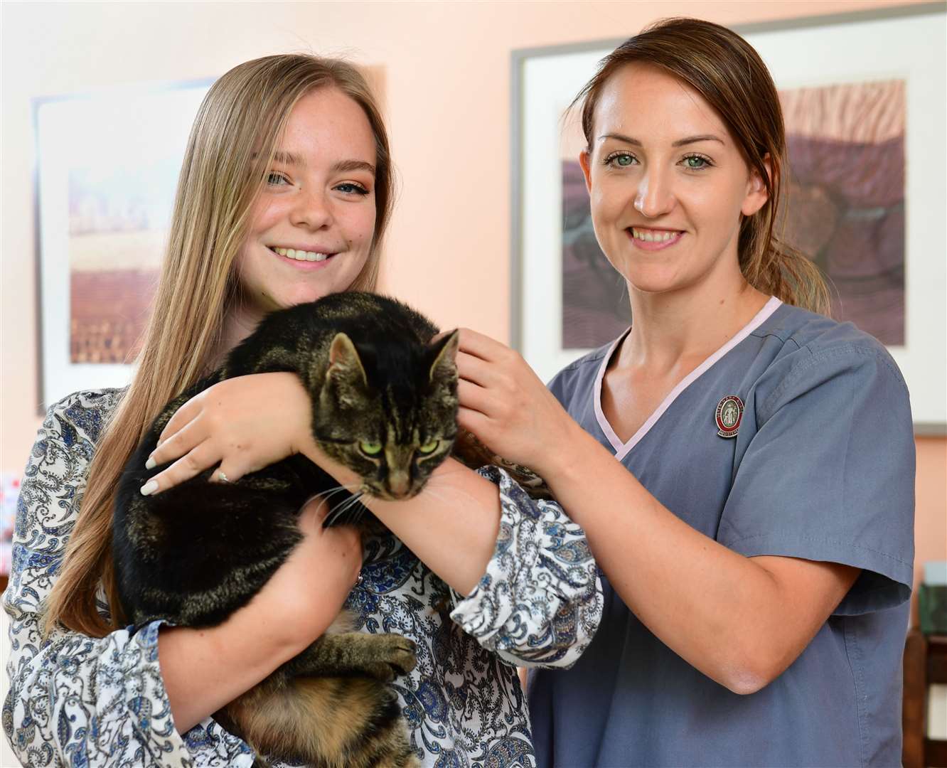 Cobweb back home in Westerham with owner Ella Clark, 19, and Mark Nelson head veterinary nurse Gemma Wade