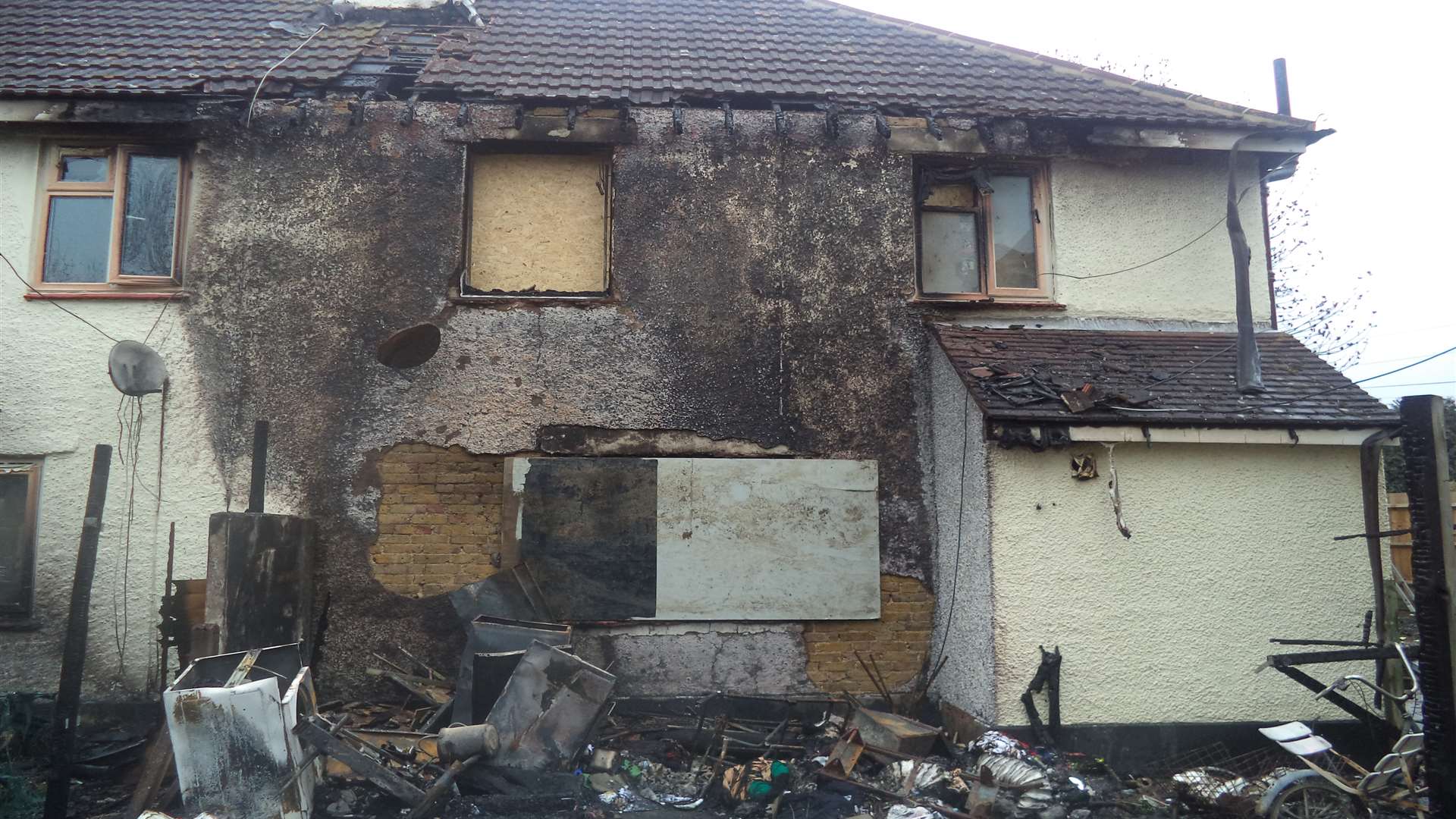 The fire damage to the back of the house