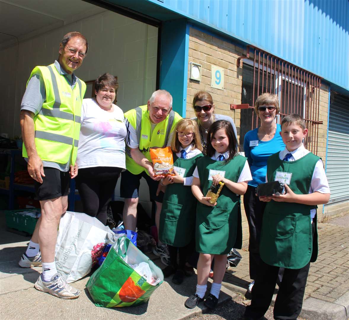 Dover Foodbank volunteers with pupils at White Cliffs Primary