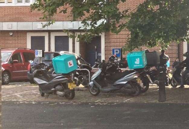 Mopeds used by delivery riders parked up in Canterbury Lane