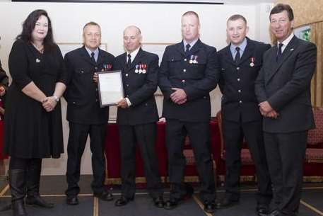 Firefighter Jason LaHaye, Watch Manager Jamie Muddle, Firefighter Mark Seal, Crew Manager Mike Blundred, receiving their Certificate of Congratulation from Kent Fire and Rescue Service Chief Executive Ann Millington (far left) and Chairman of Kent and Medway Fire and Rescue Authority, Nick Chard (far right).