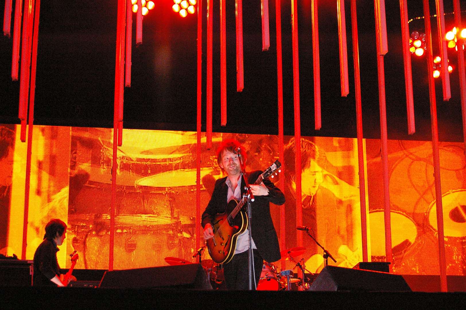 Radiohead performing on stage. Photo by Nicolas Lœuillet