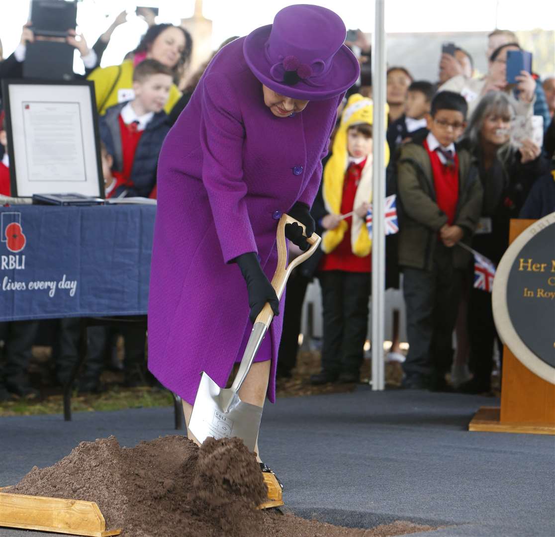 Her Majesty officially plants the time capsule. Picture: Andy Jones