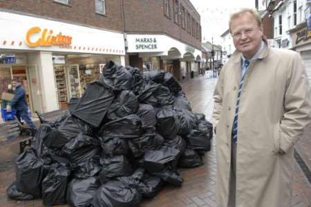 Cllr Nick Bell shows what just a sixth of the rubbish collected in Ashford each day looks like. Picture Gary Browne