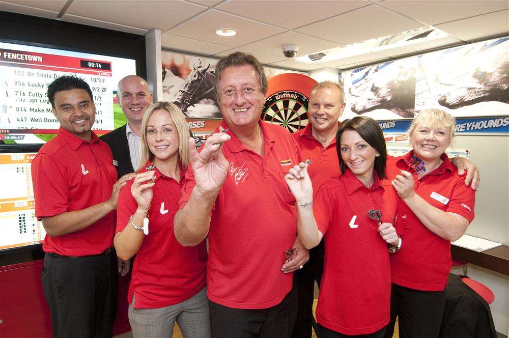 Darts legend Eric Bristow with the Ladbrokes team at the High Street, Sheerness, shop