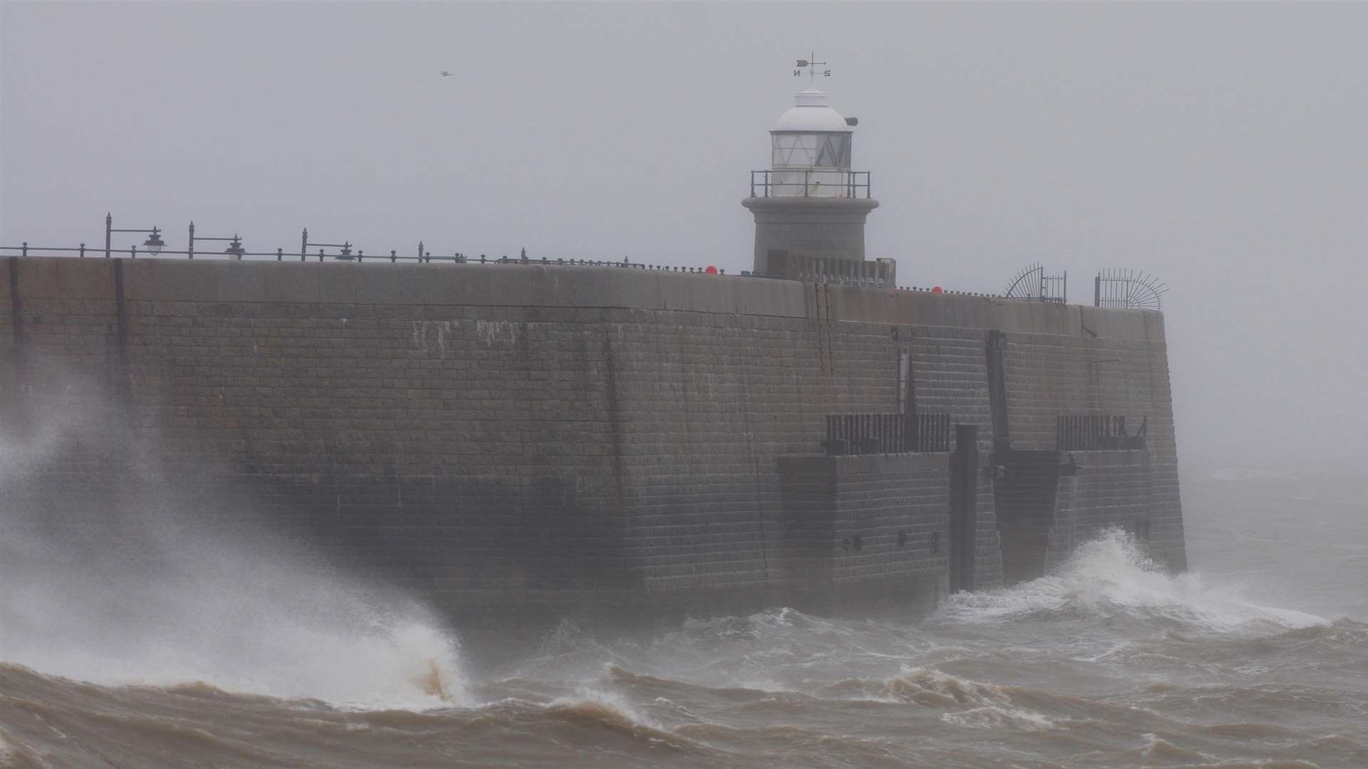 Strong winds and large waves at Folkestone harbour. Library image.