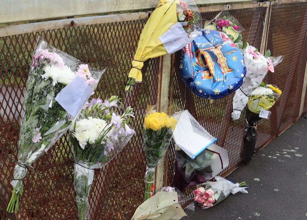 Floral tributes and a 16th birthday balloon left for Ellis at the scene