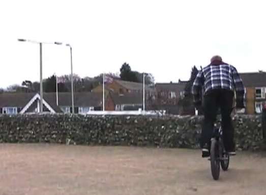 Cyclist approaches wall's edge