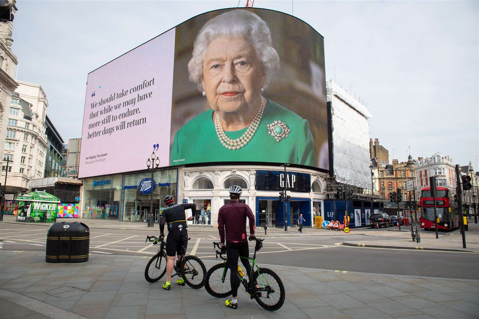 An image of the Queen and quotes from her broadcast to the UK and the Commonwealth on the coronavirus pandemic were displayed at London’s Piccadilly Circus in April (Dominic Lipinski/PA)