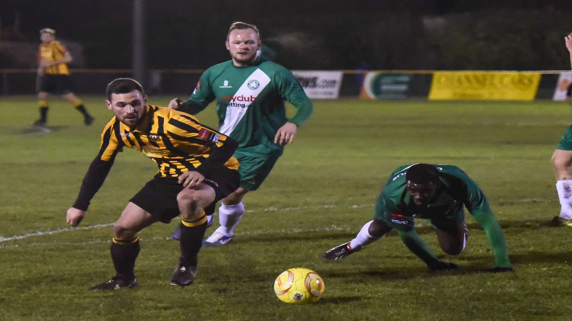 Ronnie Dolan gets the better of two Whyteleafe players in the penalty area Picture: Alan Langley