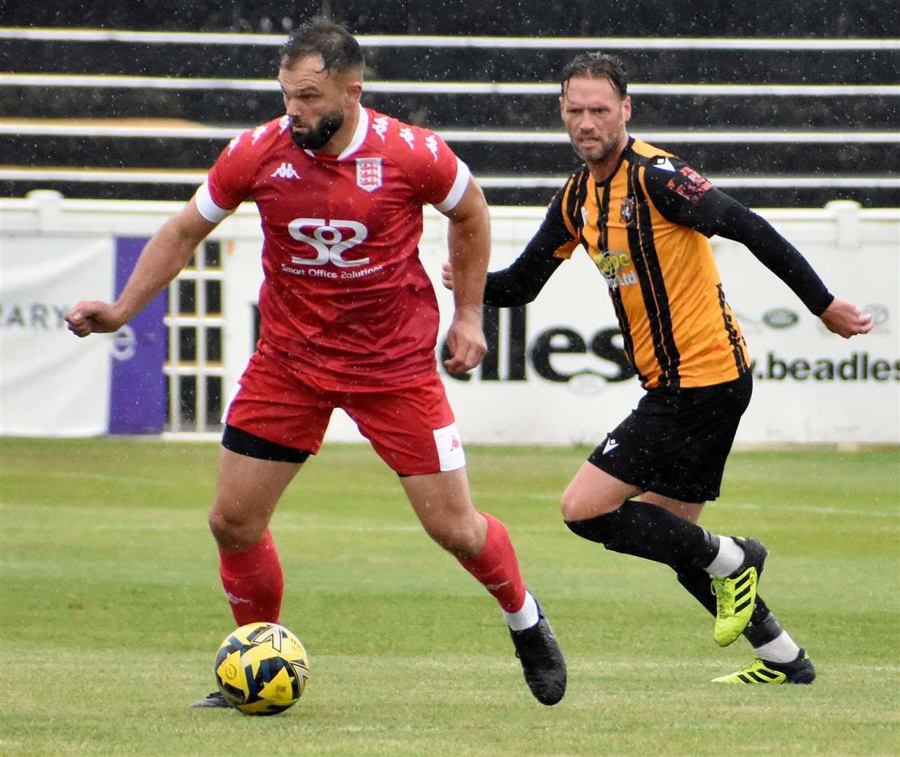Folkestone player-coach Andy Drury, right, came off against Haringey in the first half with an injury. Picture: Randolph File