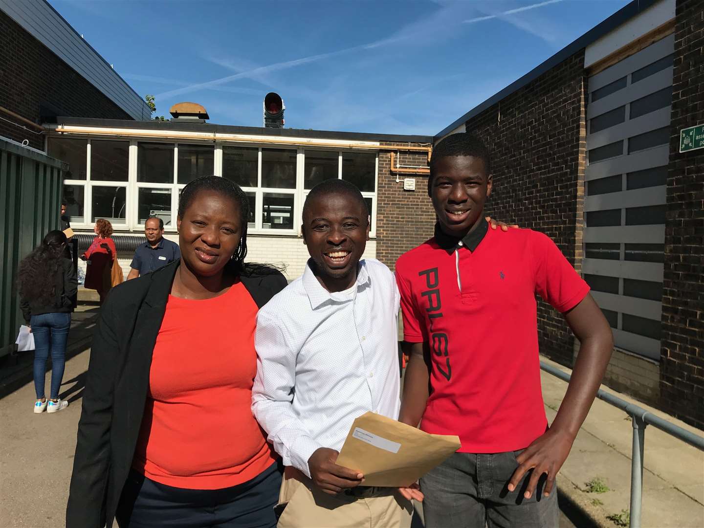 Deminion Shoroye, 16, from Slade Green, with parents Samuel and Bola (15604406)