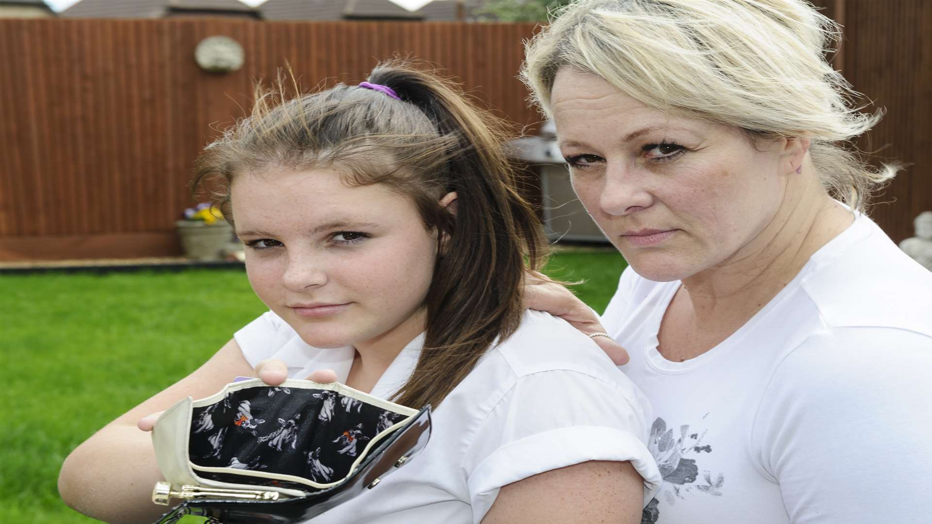 Elli Baker, 14, of Beaumont Road, Maidstone, was mugged in Barming Park for the money in her purse. She is pictured with her mother Michelle Baker. Picture: Andy Payton FM4778885