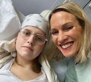 Evie Dove in hospital with mum Katie as she battled a brain tumour