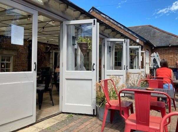 The conservatory at the back of the hotel has a series of folding doors which can be opened during warmer weather