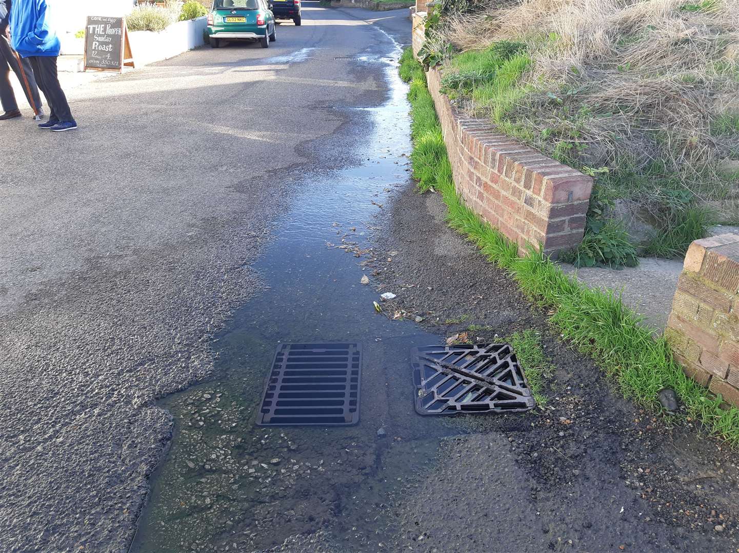 Water draining away on a dry day because of the leak. Picture: Sam Lennon KMG