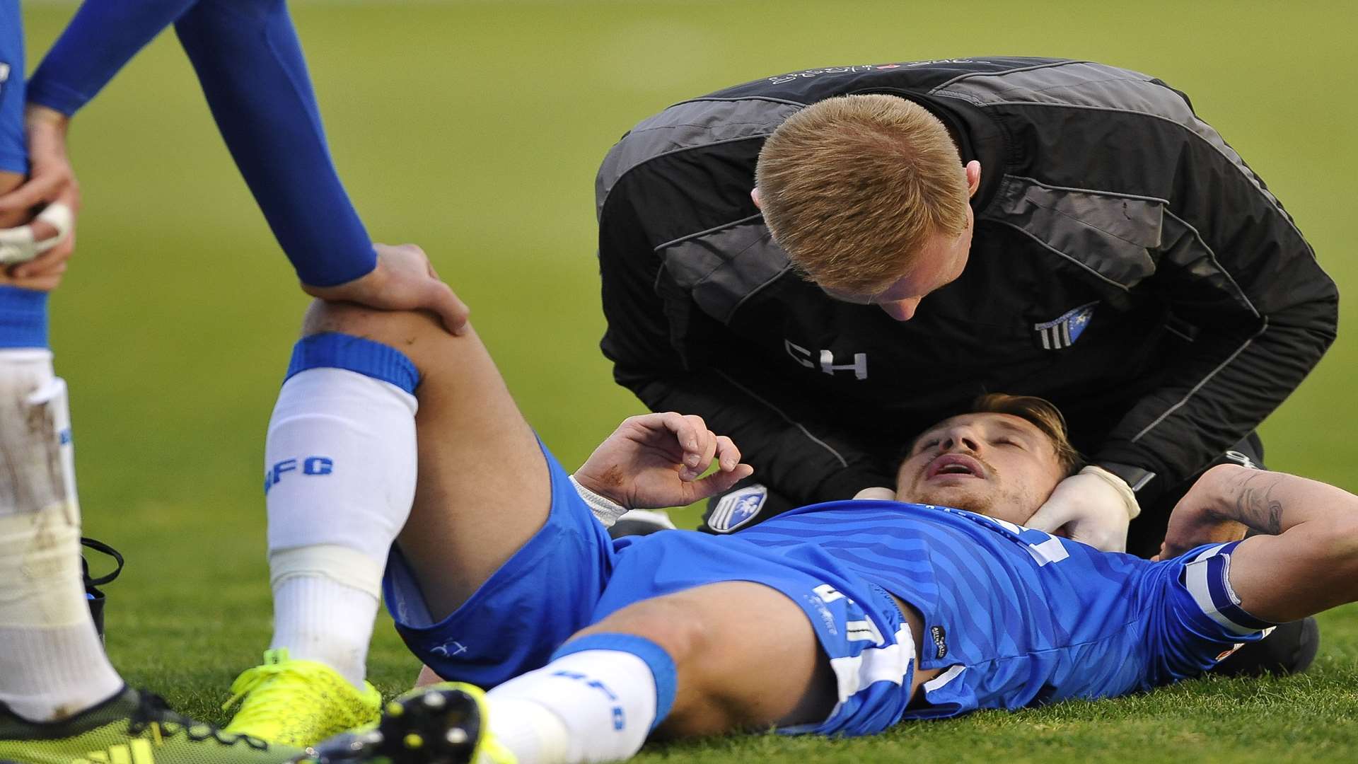 Lee Martin is treated by Gills physio Gary Hemens before a precautionary check-up in hospital Picture: Ady Kerry