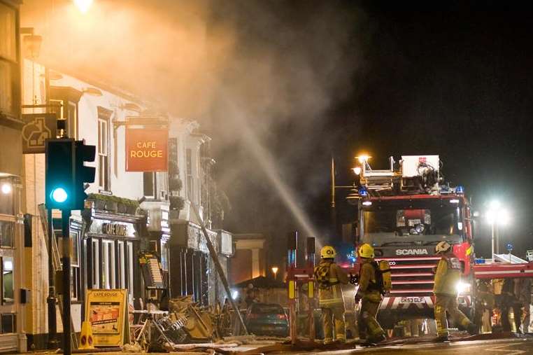 Water is targeted at buildings ablaze in Tenterden. Picture: Geoff Partner