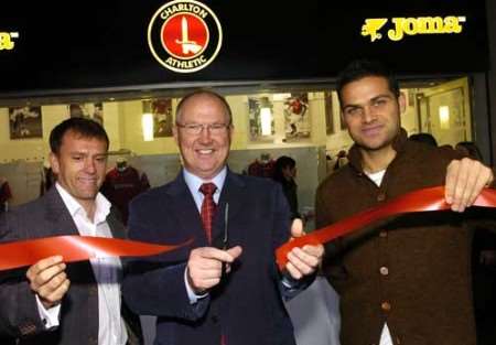 Les Reed cuts the ribbon flanked by Mark Robson and Luke Young. Picture: NICK JOHNSON