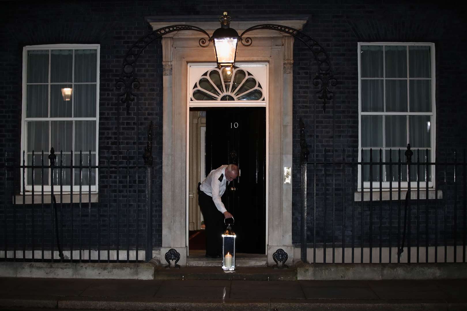 A candle lit by Prime Minister Boris Johnson and his fiancee Carrie Symonds is placed on the doorstep of 10 Downing Street (Aaron Chown/PA)