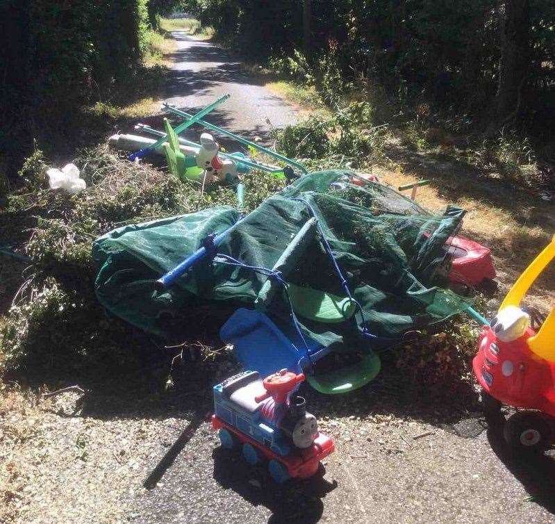 Kent County Council's Highways team has launched an investigation after a range of kids' toys were found dumped in Ayleswade Lane in Frittenden. Photo: KCC Highways