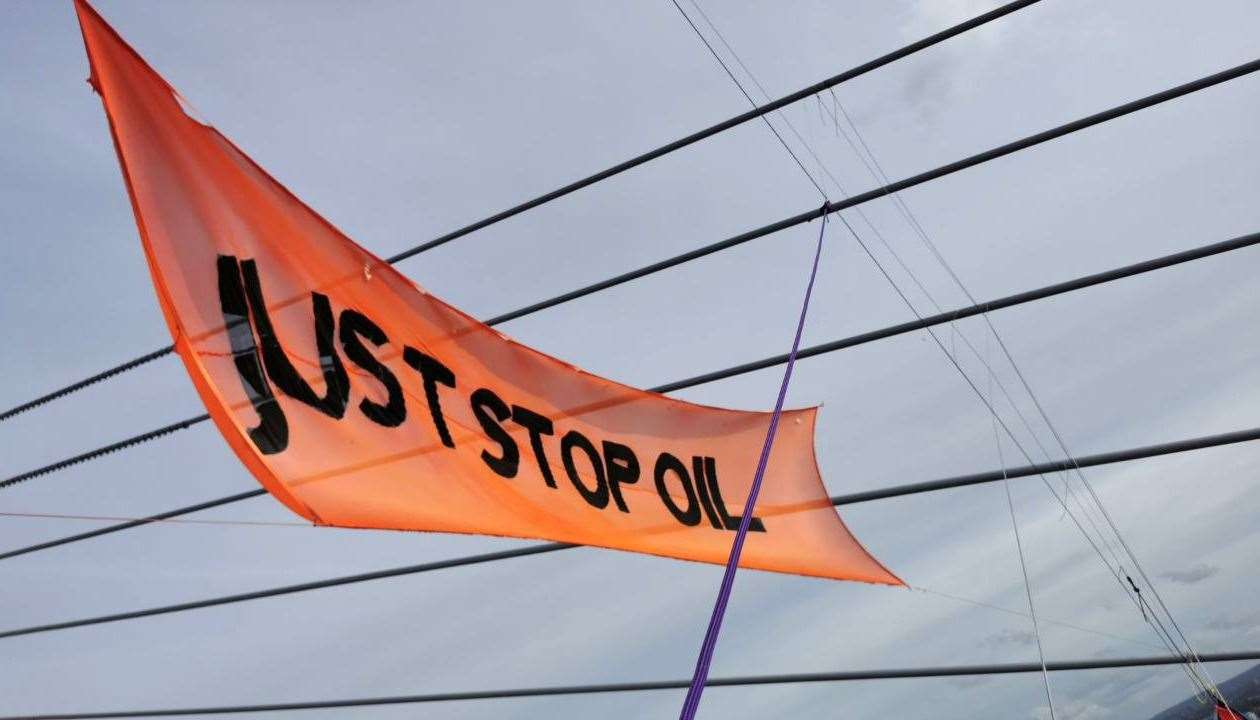 Just Stop Oil protesters remain at the top of the QEII Picture: Just Stop Oil